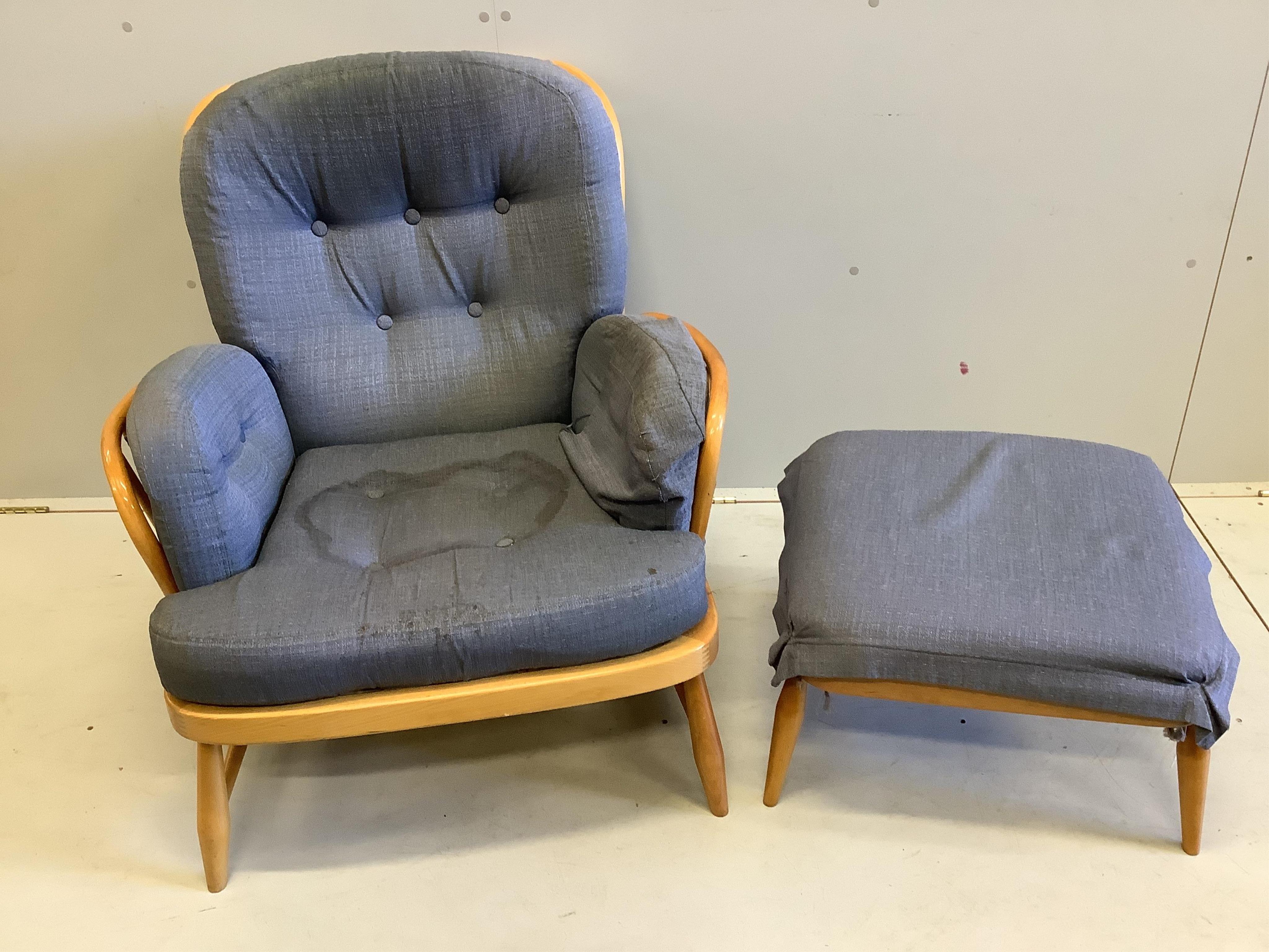 An Ercol armchair, width 80cm, 76cm, height 78cm and footstool. Condition - fair